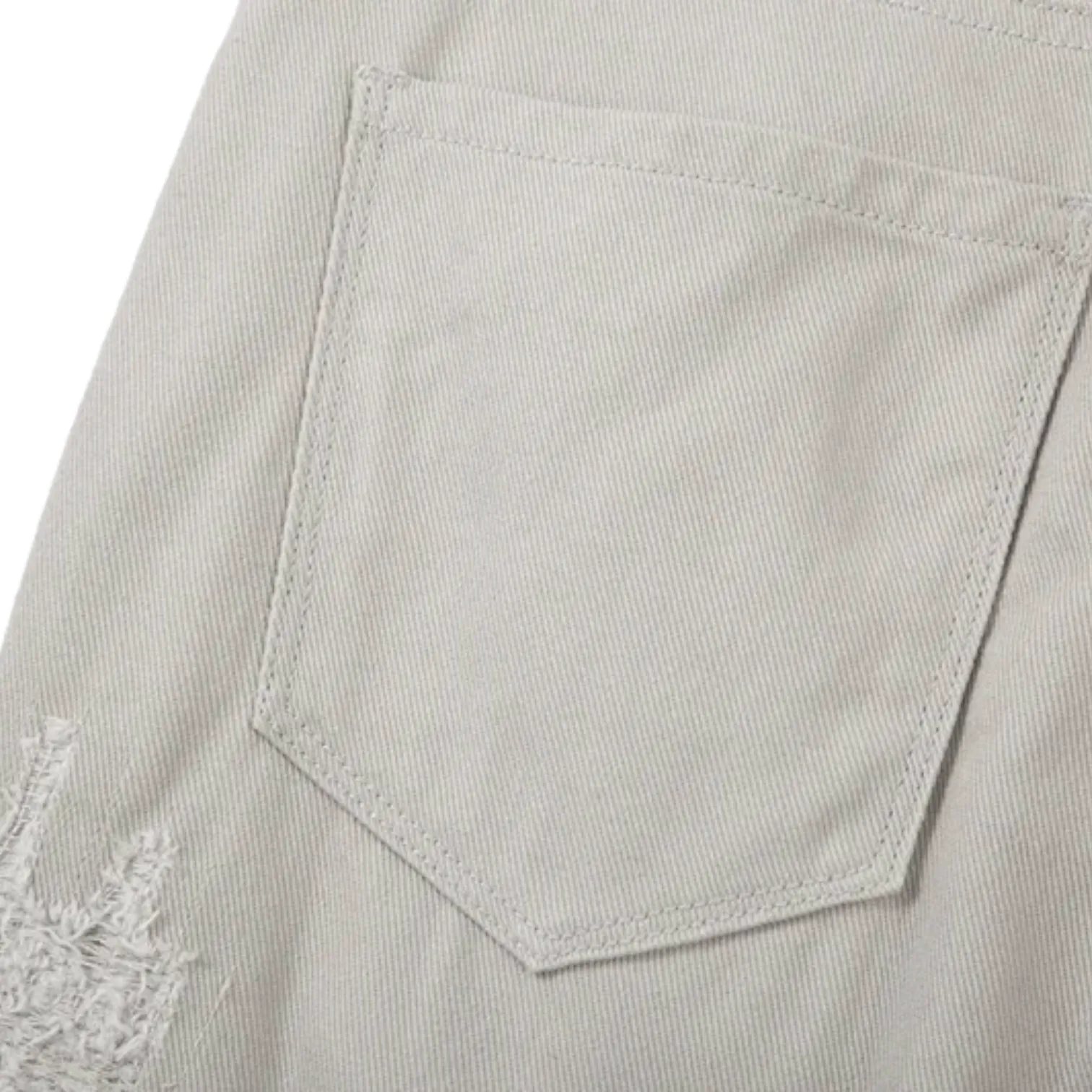 Slim fit distressed jean with back leg zipper