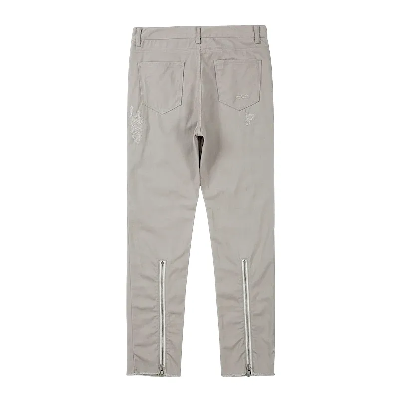 Slim fit distressed jean with back leg zipper